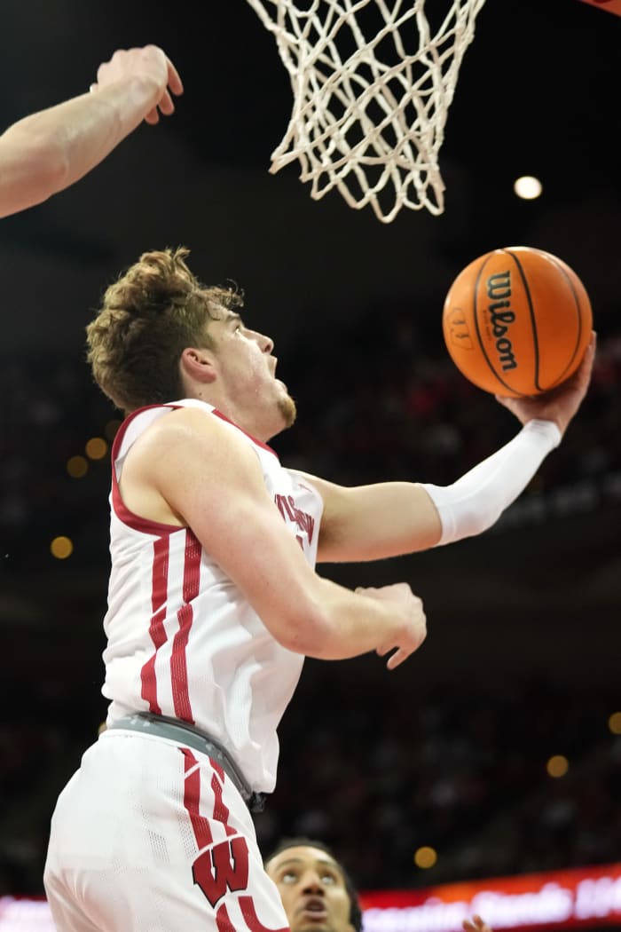 Mar 2, 2023; Madison, Wisconsin, USA; Wisconsin Badgers guard Max Klesmit (11) shoots the ball during the second half against the Purdue Boilermakers at the Kohl Center. Mandatory Credit: Kayla Wolf-USA TODAY Sports